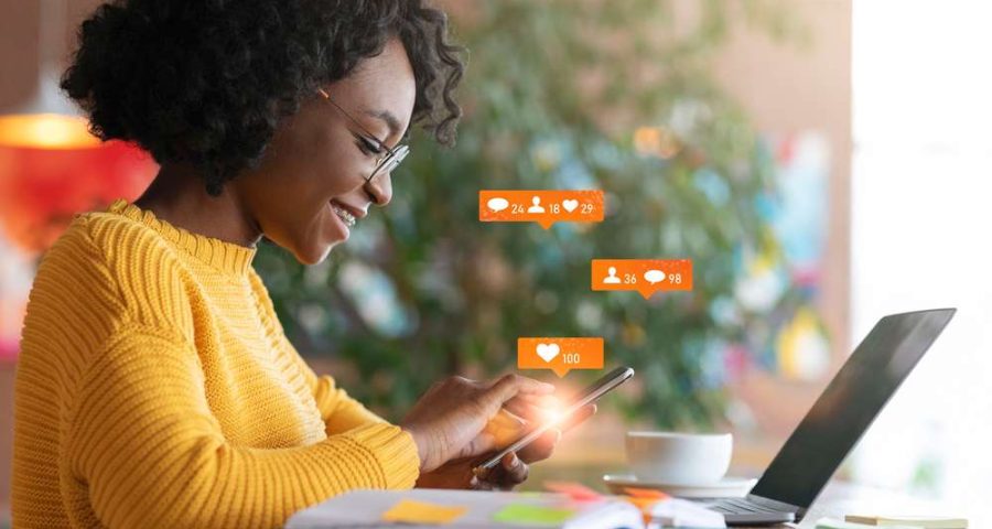 African,American,Lady,Using,Laptop,Texting,In,Online,Social,Media