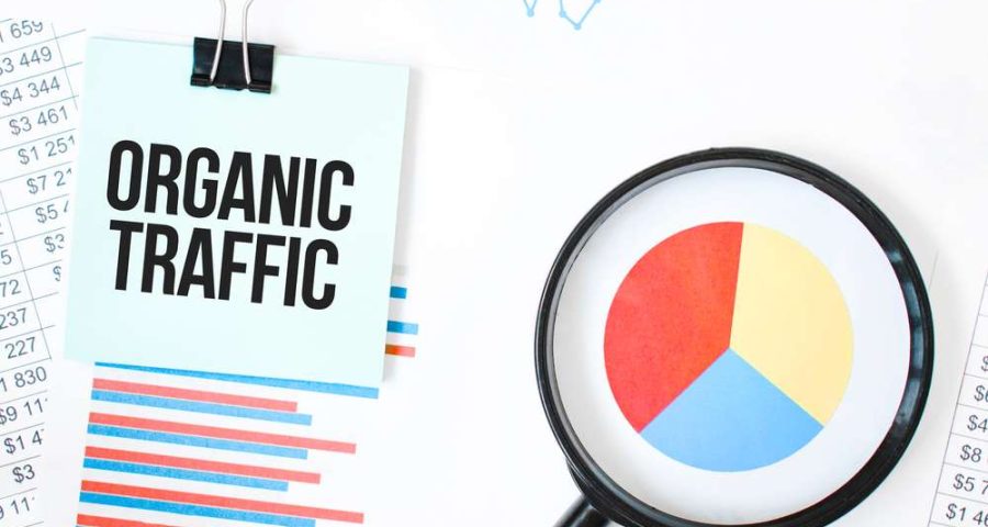 Green,Card,On,The,White,Notepad,And,Magnifier,On,The