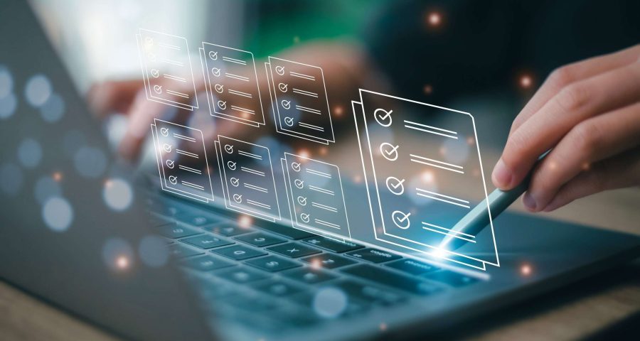 business woman checking off boxes on computer