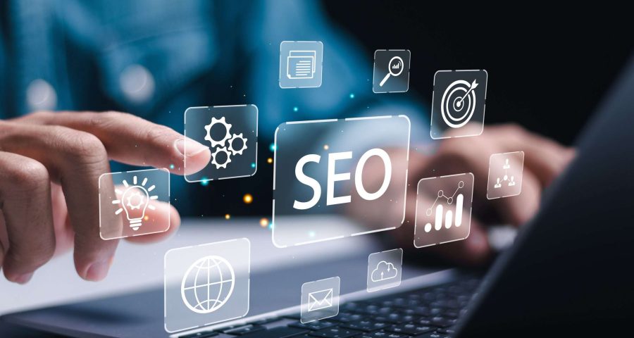 computer screen with someone pointing at SEO