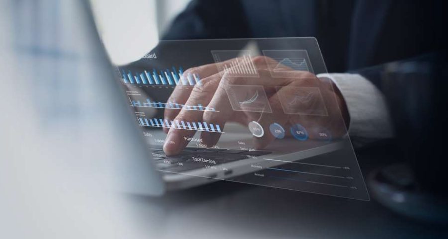 a businessman typing and reading his website analytics