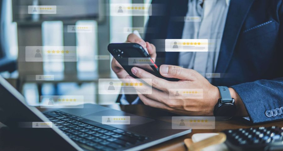 5 star reviews around someone on their phone