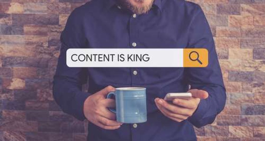 a person searching the phrase "content is king' on their smartphone