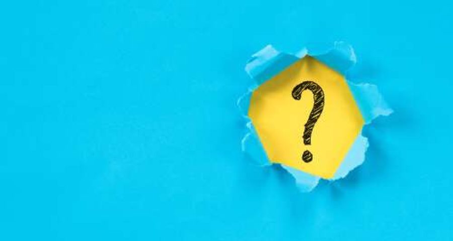 question mark ripped through paper