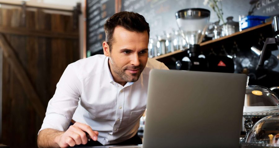 small business owner making service area page to improve local SEO.